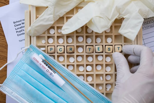 the word 'pcr test' is written on a board with a photo