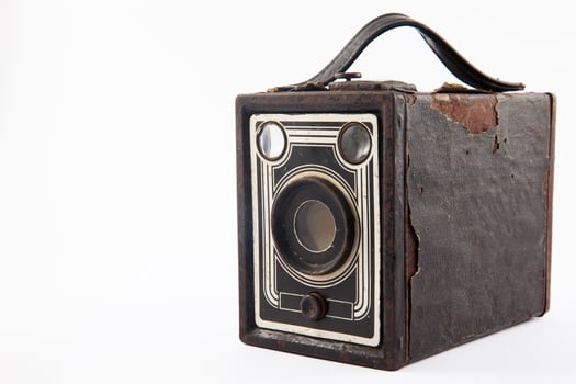 Antique camera isolated on white background photo