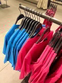 Clothes hanger boutique. Bright clothes. Style and wardrobe. photo