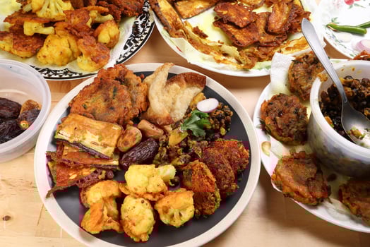 Indian Bengali stye variety fitter deep fried tanpura piaju pakoda battered cauliflower eggplant dumplings chola dal fry dates for iftar breakfast snack comfort food photo