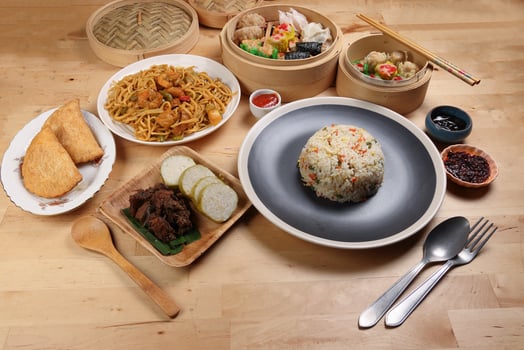 Dumplings dim sum bamboo steamer egg fried rice pulut lemang beef rendang stair fried tofu shrimp noodles chili oil dark soya sauce chpstick fork spoon on wooden table variety cuisine snack fast food photo