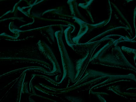 Green velvet fabric texture used as background. Empty green fabric background of soft and smooth textile material. There is space for text. photo