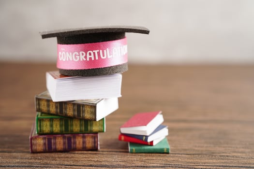 Graduation hat on book with copy space, learning university education concept. photo