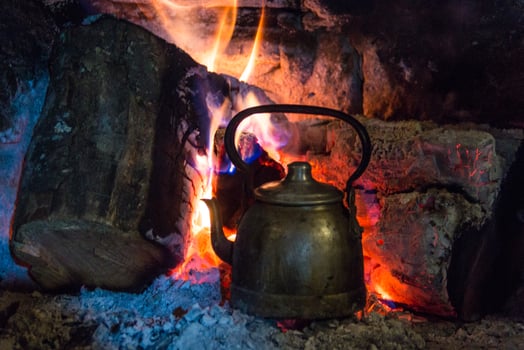 kettle on the firewood to heat the mate water in the Argentine countryside photo