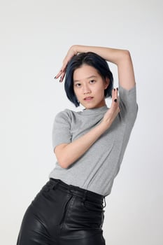 Young attractive Asian chinese malay woman pose face body expression mode emotion on white background fashion walk twist photo