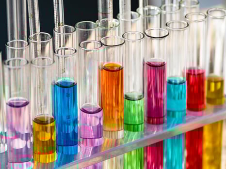 Test tubes with a colored reagents in a rack. photo
