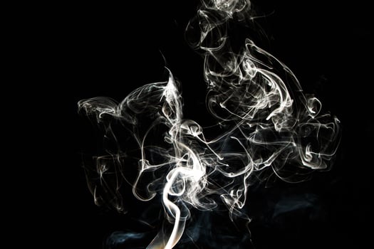 Smoke effect texture. Isolated background. Black and dark backdrop. Smokey fire and mistic effect. photo