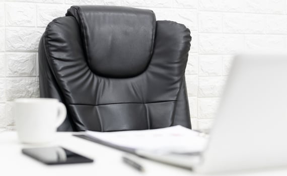 Executive chair then coffee and computer in the office photo