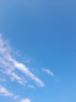 The white clouds on the blue sky are perfect for the background.  Skyscape on Lombok Island, Indonesia photo