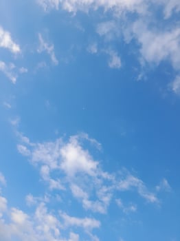 The white clouds on the blue sky are perfect for the background.  Skyscape on Lombok Island, Indonesia photo