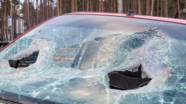 Broken windshield from a car accident. The windshield of the car was broken. Broken windproof car accident. Car accident. A window repair company will come to you to replace the broken glass. photo