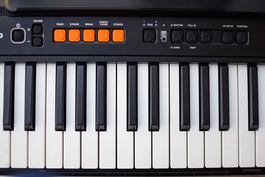 Close-up of piano keys. Piano black and white keys and Piano keyboard musical instrument placed at the home balcony during sunny day. photo