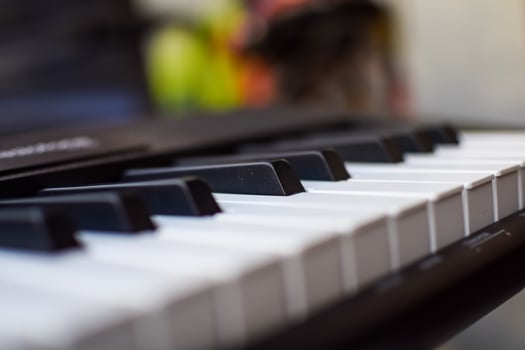 Close-up of piano keys. Piano black and white keys and Piano keyboard musical instrument placed at the home balcony during sunny day. photo