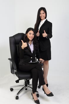 One young Asian Malaysian business office woman holding blank copy text space sign board on white background photo