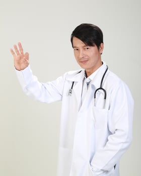 Young Asian male doctor wearing apron uniform tunic apron hold photo