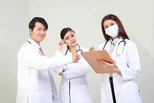 Young Asian male female doctor wearing apron uniform tunic apron hold photo