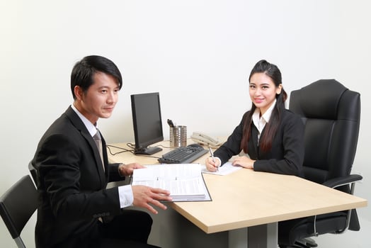 Young Asian man woman wearing business office suit chair table computer white background photo