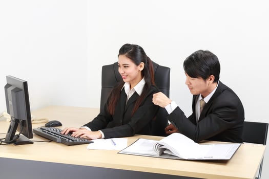 Young Asian man woman wearing business office suit chair table computer white background photo