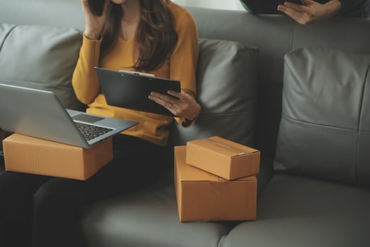 Business woman start up small business entrepreneur SME success .freelance woman working at home with Online Parcel delivery. SME and packaging deliveryconcept photo