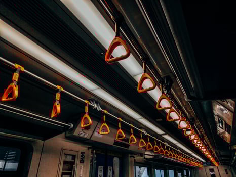 Empty yellow handle grip on public transportation photo