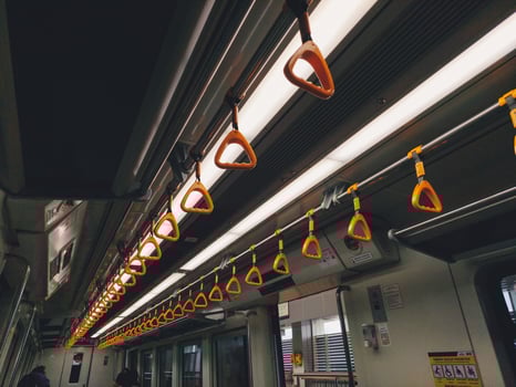 Empty yellow handle grip on public transportation photo