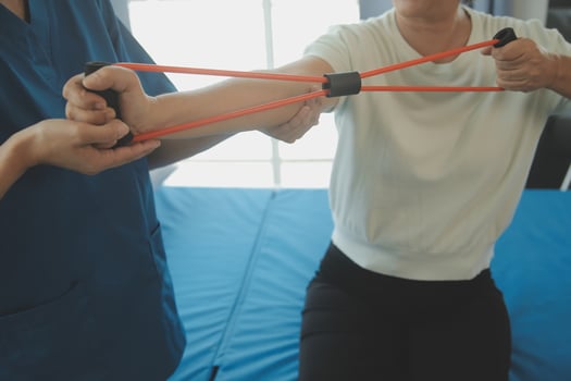 Patient doing some special exercises under supervision in a room photo