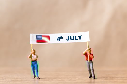 Americans raising flags in celebration of the Fourth of July and Independence Day photo