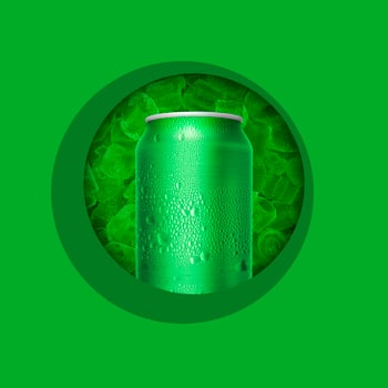 Cans with water droplets and ice on green background photo