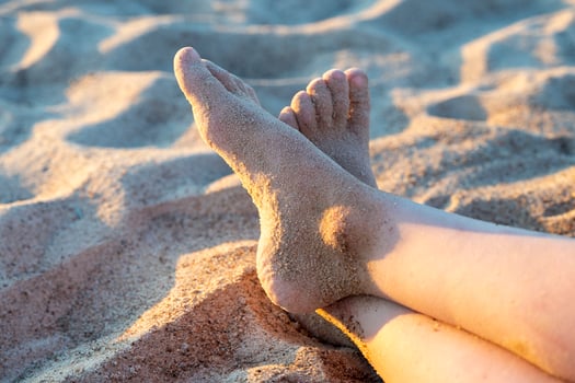 children's feet in the sand on the beach. Vacation time, Summer photo