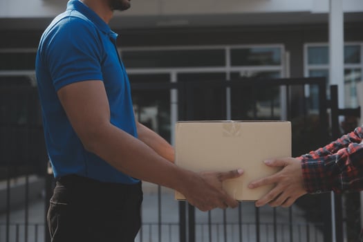 Startup small business entrepreneur of freelance Asian woman using a laptop with box Cheerful success Asian woman her hand lifts up online marketing packaging box and delivery SME idea concept photo