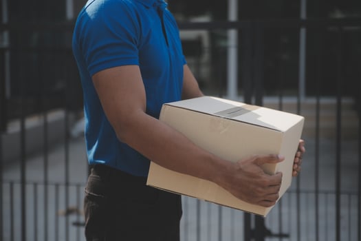 Startup small business entrepreneur of freelance Asian woman using a laptop with box Cheerful success Asian woman her hand lifts up online marketing packaging box and delivery SME idea concept photo