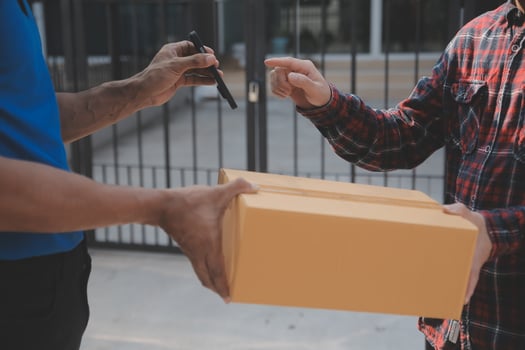 Startup small business entrepreneur of freelance Asian woman using a laptop with box Cheerful success Asian woman her hand lifts up online marketing packaging box and delivery SME idea concept photo