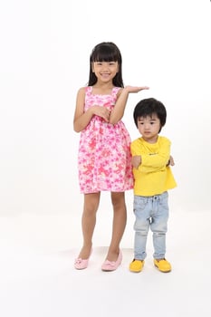 south East Asian brother sister child playing posing on white background photo