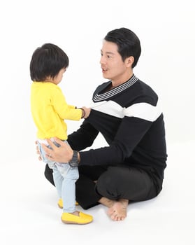 South East Asian young father mother daughter son parent boy girl child activity indoor photo