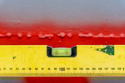 bubble construction level with a length marking on a gray background photo