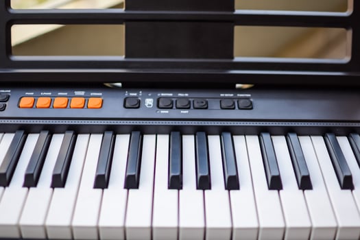 Close-up of piano keys. Piano black and white keys and Piano keyboard musical instrument placed at the home balcony during sunny day. photo