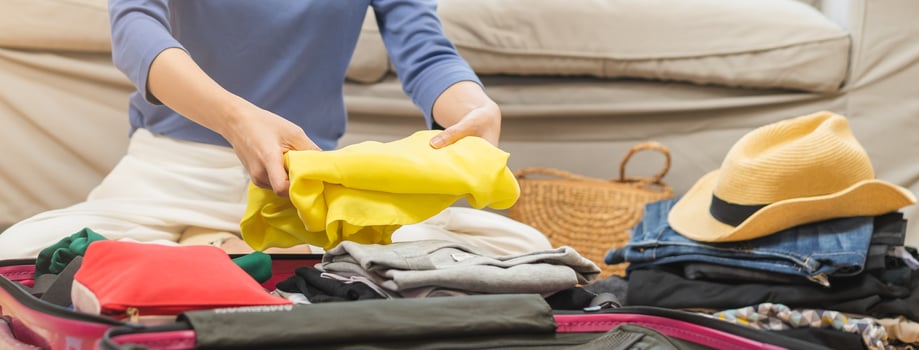 Backpacker travel of journey, asian young woman, packing or prepare clothes into luggage, traveler case for journey trip, note and check list for holiday vacation at home. Voyage of traveler people. photo