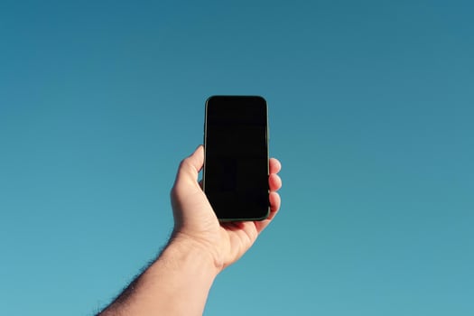 hand holding a mobile phone, mobile phone addiction photo