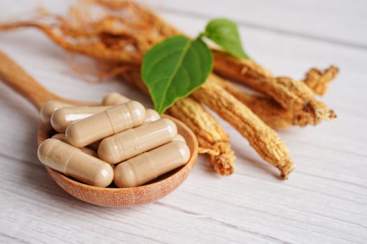 Ginseng roots and green leaf, healthy food. photo