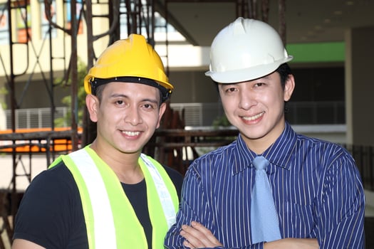 South East Asian young Malay Chinese man woman wearing safely helmet construction site work photo