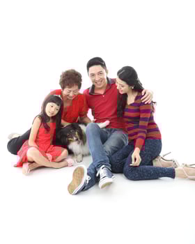 Southeast Asian multigeneration family parents daughter grandmother father mother child pose happy sit stand photo