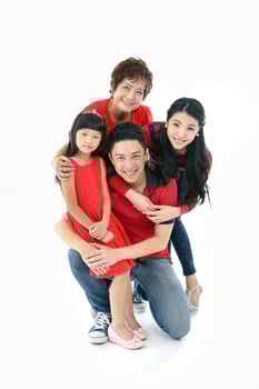 Southeast Asian multigeneration family parents daughter grandmother father mother child pose happy sit stand photo