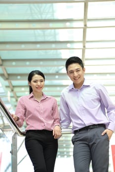 Young south east Asian middle eastern man woman business colleague outdoor stand pose photo