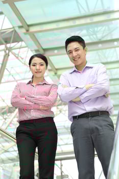 Young south east Asian middle eastern man woman business colleague outdoor stand pose photo
