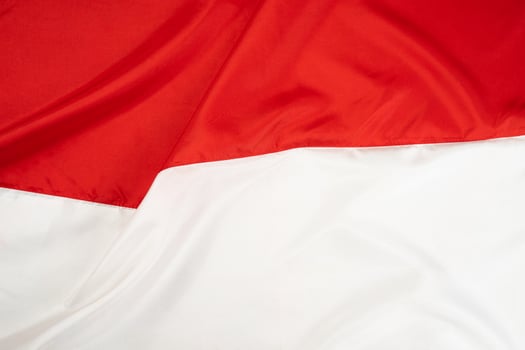 Wavy Indonesian national flag background photo
