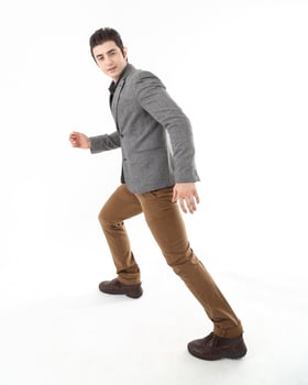 Young man wearing formal casual business work suit active expression photo