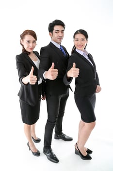 Southeast Asian young office business man woman wearing suit thumbs up on white studio background photo