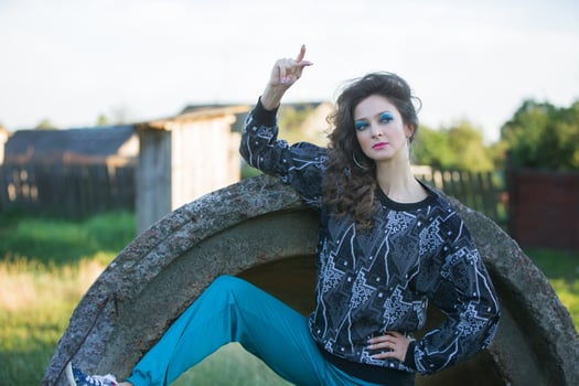 A funny girl in the style of the nineties. photo