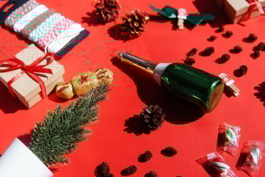 Christmas background with Xmas gifts and candy canes on red. flat lay. Space for text photo