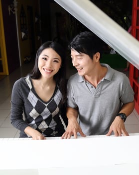 South East Asian young father mother daughter  parent girl child activity indoor photo